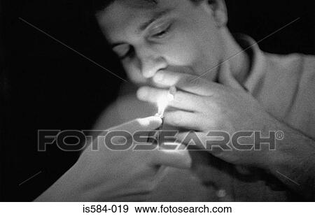 Man smoking a cigarette View Large Photo Image Stock Photo - Man smoking a cigarette. Fotosearch