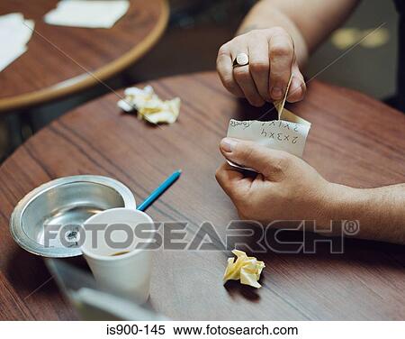Stock Photography - Man tearing up betting slip. Fotosearch