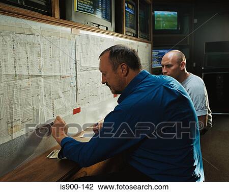 Men in a betting shop View Large Photo Image Stock Image - Men in a betting shop. Fotosearch