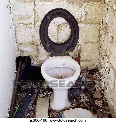 Stock Photograph - Messy outhouse. Fotosearch