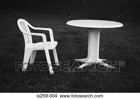 Plastic outdoor table and chair View Large Photo Image Picture - Plastic outdoor table and chair. Fotosearch