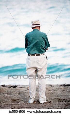 Senior man on beach View Large Photo Image Stock Photograph - Senior man on beach. Fotosearch
