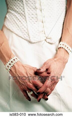 Transvestite wearing a white dress View Large Photo Image Stock Image - Transvestite wearing a white dress. Fotosearch