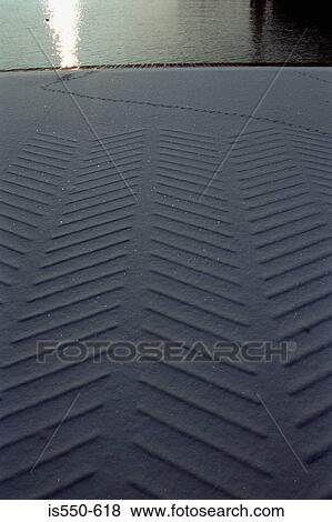 Tyre tracks in snow View Large Photo Image Stock Photo - Tyre tracks in snow. Fotosearch