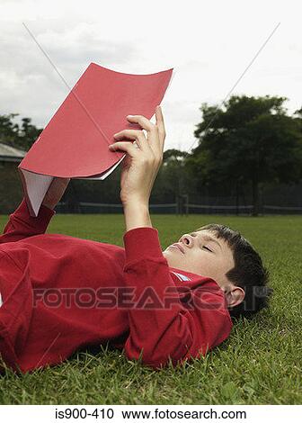 Boy with a notebook in park View Large Photo Image Stock Image - Boy with a notebook in park. Fotosearch