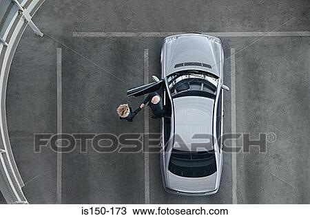 Business people shaking hands by a car View Large Photo Image Stock Image - Business people shaking hands by a car. Fotosearch