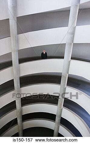 Stock Photo - Businessman in a multistorey car park. Fotosearch