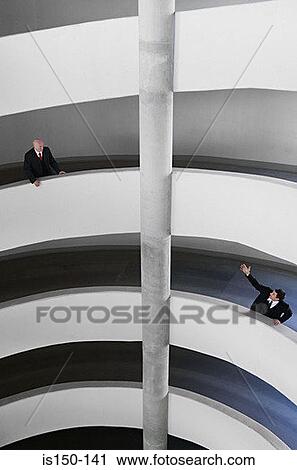 Businessmen in a multistorey car park View Large Photo Image Stock Image - Businessmen in a multistorey car park. Fotosearch