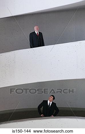 Picture - Businessmen on different levels. Fotosearch