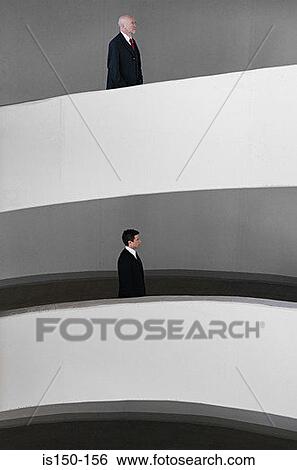 Stock Photograph - Businessmen on different levels. Fotosearch