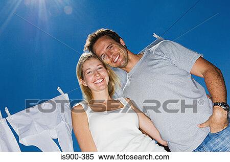 Couple by washing line View Large Photo Image Stock Photography - Couple by washing line. Fotosearch