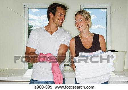 Stock Photography - Couple doing housework. Fotosearch