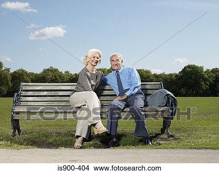 Elderly couple on a park bench View Large Photo Image Picture - Elderly couple on a park bench. Fotosearch