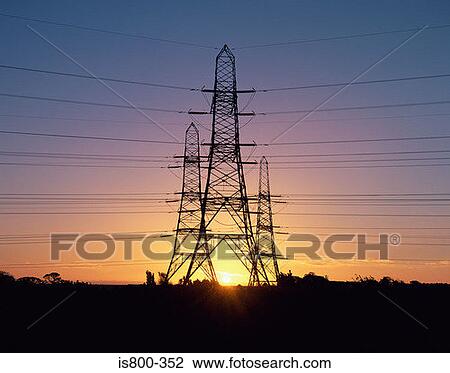 Electricity pylons at sunrise View Large Photo Image Stock Image - Electricity pylons at sunrise. Fotosearch