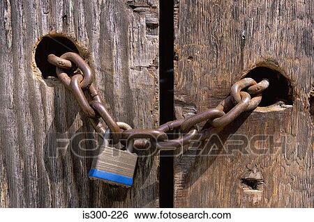 Lock and chain through wooden door View Large Photo Image Stock Photograph - Lock and chain through wooden door. Fotosearch