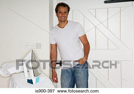 Stock Photo - Man with ironing board. Fotosearch