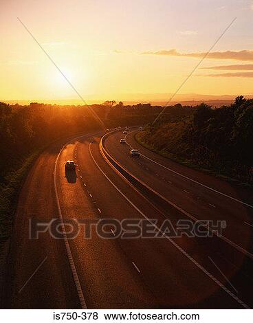 Stock Photo - Road at sunset. Fotosearch
