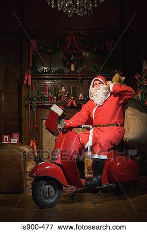 Santa claus riding a moped View Large Photo Image Stock Photo - Santa claus riding a moped. Fotosearch