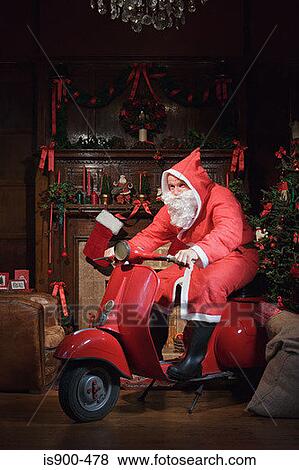 Santa claus riding a moped View Large Photo Image Stock Photo - Santa claus riding a moped. Fotosearch
