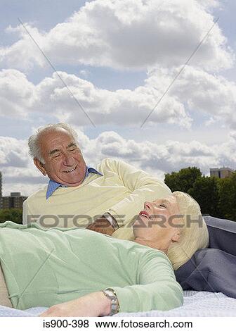 Stock Photo - Senior couple in the park. Fotosearch