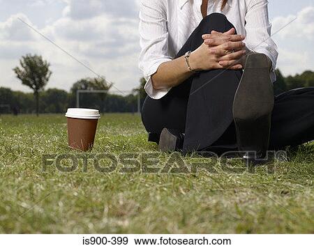 Woman sitting in the park View Large Photo Image Stock Photo - Woman sitting in the park. Fotosearch