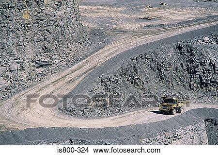Picture - Yellow truck in a quarry. Fotosearch