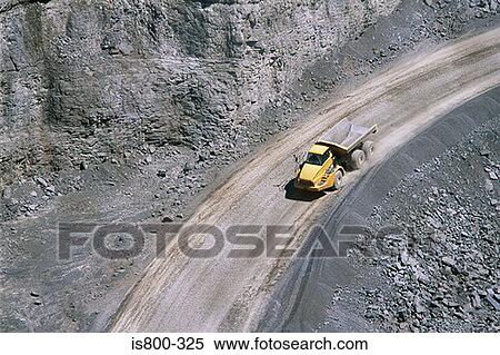Stock Photography - Yellow truck in a quarry. Fotosearch