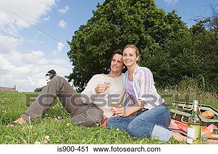Couple having a picnic View Large Photo Image Stock Image - Couple having a picnic. Fotosearch