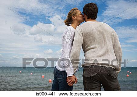 Romantic couple by the sea View Large Photo Image Stock Image - Romantic couple by the sea. Fotosearch