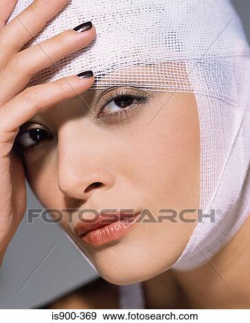 Woman with bandage on her head View Large Photo Image Stock Photo - Woman with bandage on her head. Fotosearch