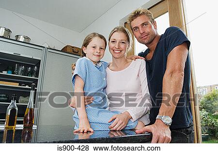 Stock Photo - Young family in the kitchen. Fotosearch
