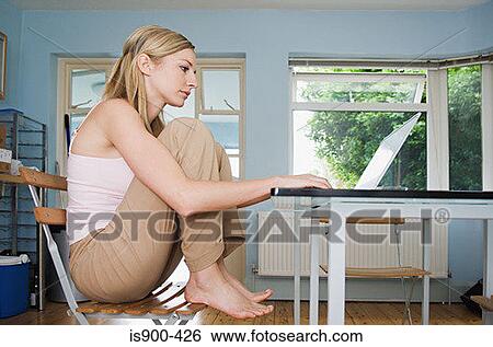 Young woman telecommuting View Large Photo Image Stock Photograph - Young woman telecommuting. Fotosearch