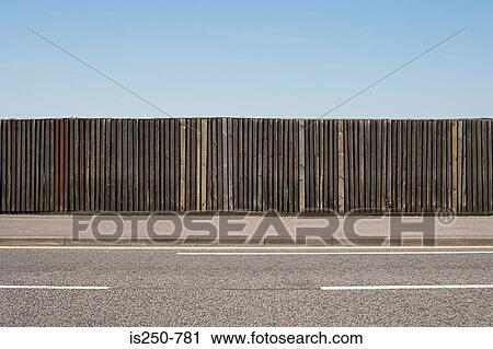 Stock Image - Fence near road. Fotosearch