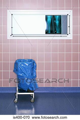 Stock Image - Rubbish bin by x-ray in hospital. Fotosearch