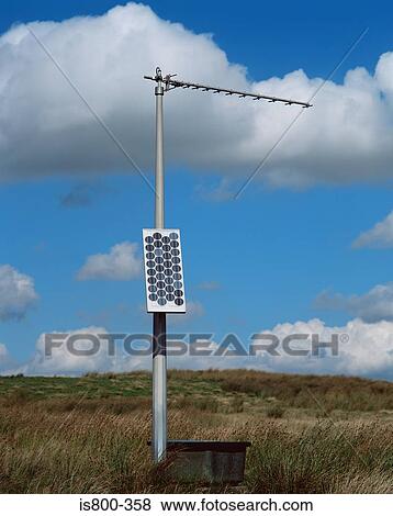 Solar panel on antenna pole in field View Large Photo Image Stock Photo - Solar panel on antenna pole in field. Fotosearch