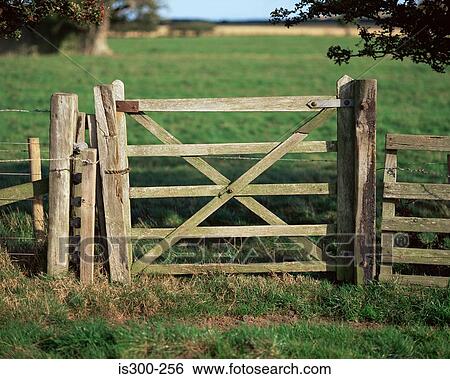 Stock Photograph - Wooden gate in field. Fotosearch