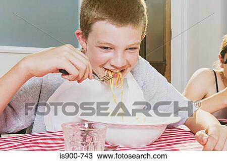 Boy eating spaghetti View Large Photo Image Stock Image - Boy eating spaghetti. Fotosearch