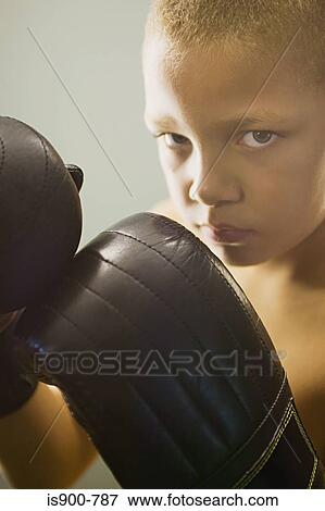 Boy wearing boxing gloves View Large Photo Image Stock Photo - Boy wearing boxing gloves. Fotosearch