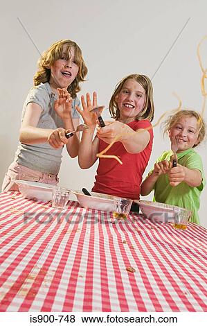 Children flicking spaghetti View Large Photo Image Stock Photo - Children flicking spaghetti. Fotosearch