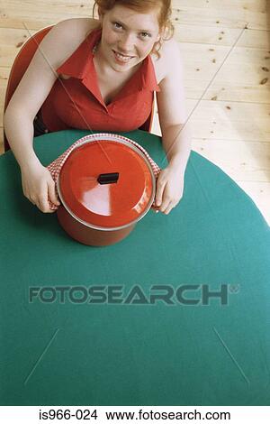 Girl holding red pot View Large Photo Image Picture - Girl holding red pot. Fotosearch