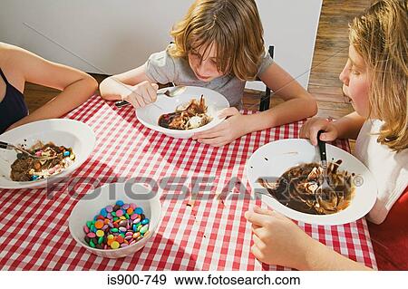 Stock Photo - Girls eating ice cream. Fotosearch