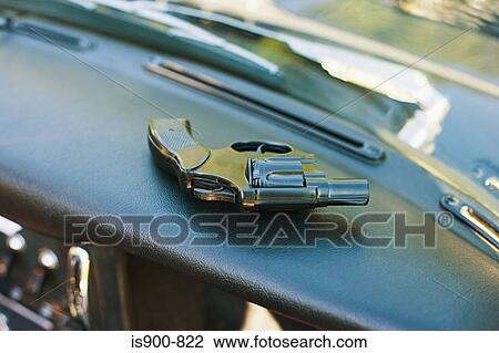 Handgun on dashboard of car View Large Photo Image Stock Image - Handgun on dashboard of car. Fotosearch