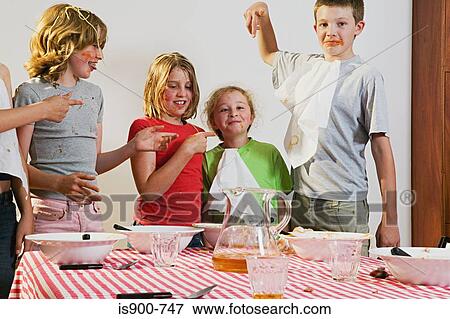 Messy children pointing at girl View Large Photo Image Stock Photo - Messy children pointing at girl . Fotosearch