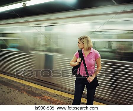 Woman on platform while train speeds by View Large Photo Image Stock Photography - Woman on platform while train speeds by. Fotosearch