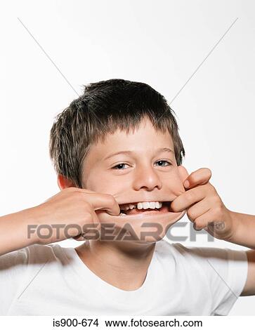 Boy pulling face View Large Photo Image Picture - Boy pulling face. Fotosearch