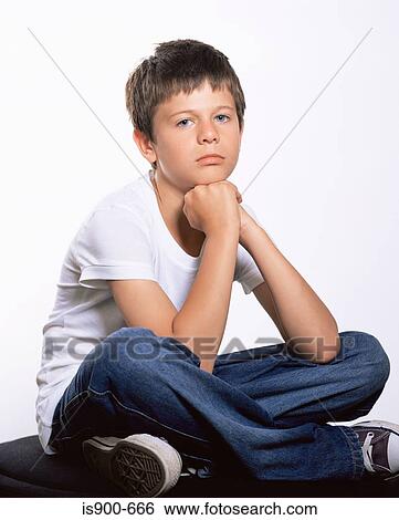 Boy sitting cross legged View Large Photo Image Stock Photograph - Boy sitting cross legged. Fotosearch