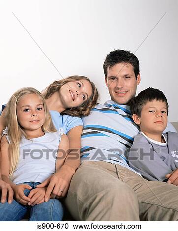 Family sitting together View Large Photo Image Stock Image - Family sitting together. Fotosearch