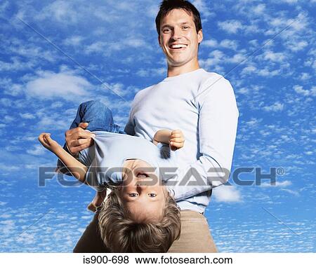 Father holding son View Large Photo Image Stock Photo - Father holding son. Fotosearch
