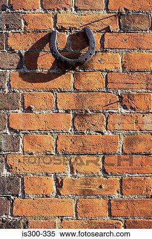 Horseshoe mounted on brick wall View Large Photo Image Stock Photography - Horseshoe mounted on brick wall. Fotosearch