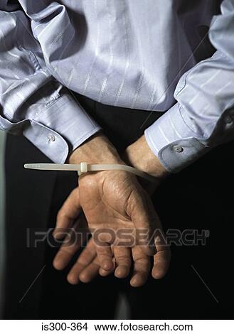 Picture - Man with hands tied. Fotosearch